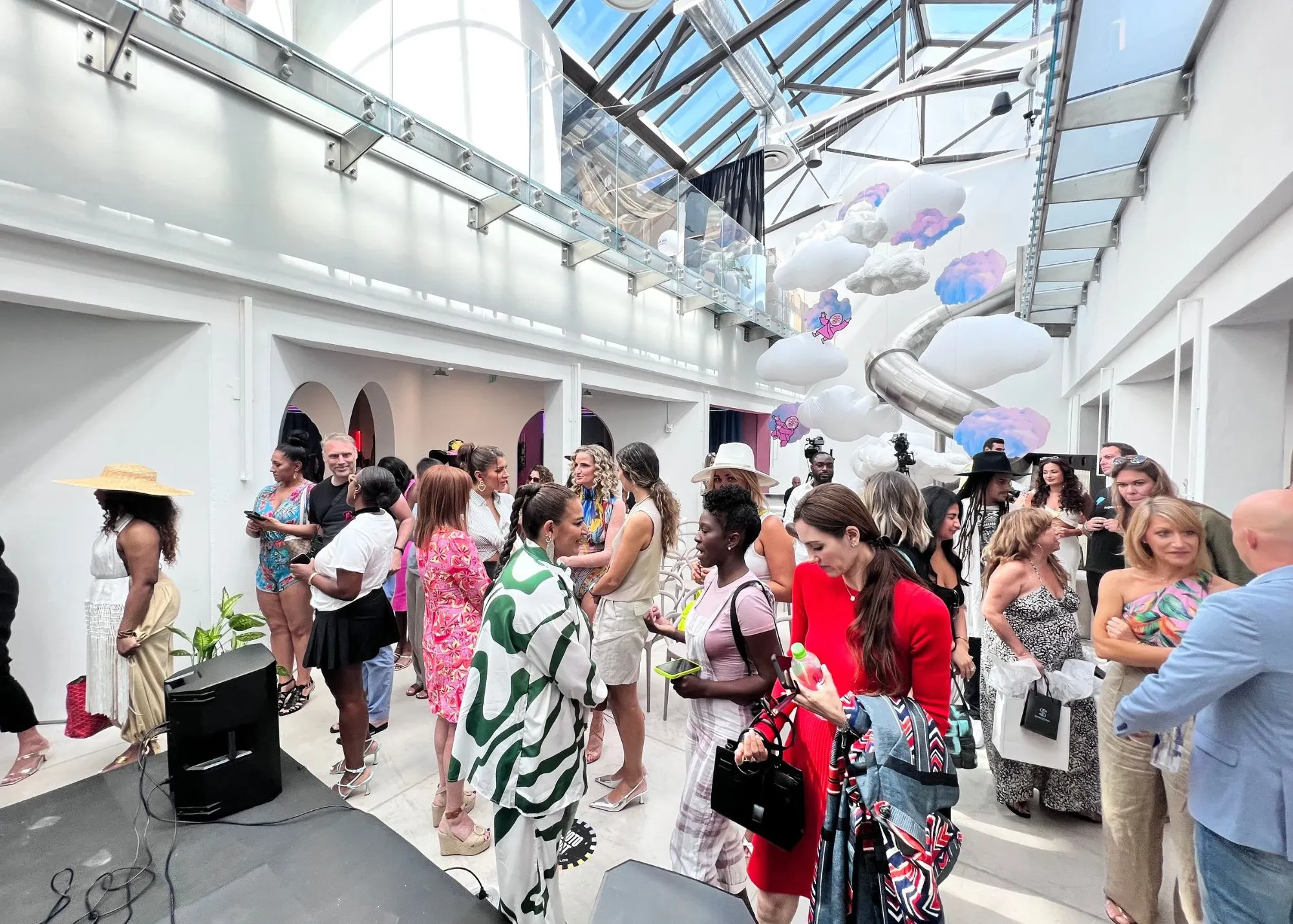 Designers and models at a Miami Swim Week fashion sponsorship event showcasing swimwear collections on the runway